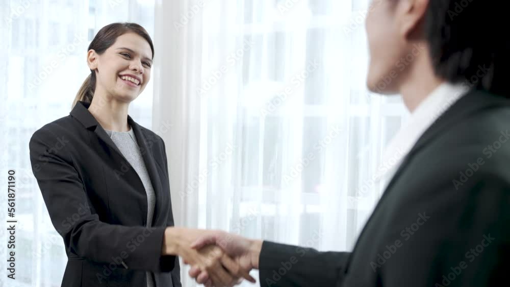 Business partners negotiating business agreements together at work, Businessmen shaking hands when packing business agreement together. Business partners negotiating business agreements together at work, Businessmen shaking hands when packing business agreement together.