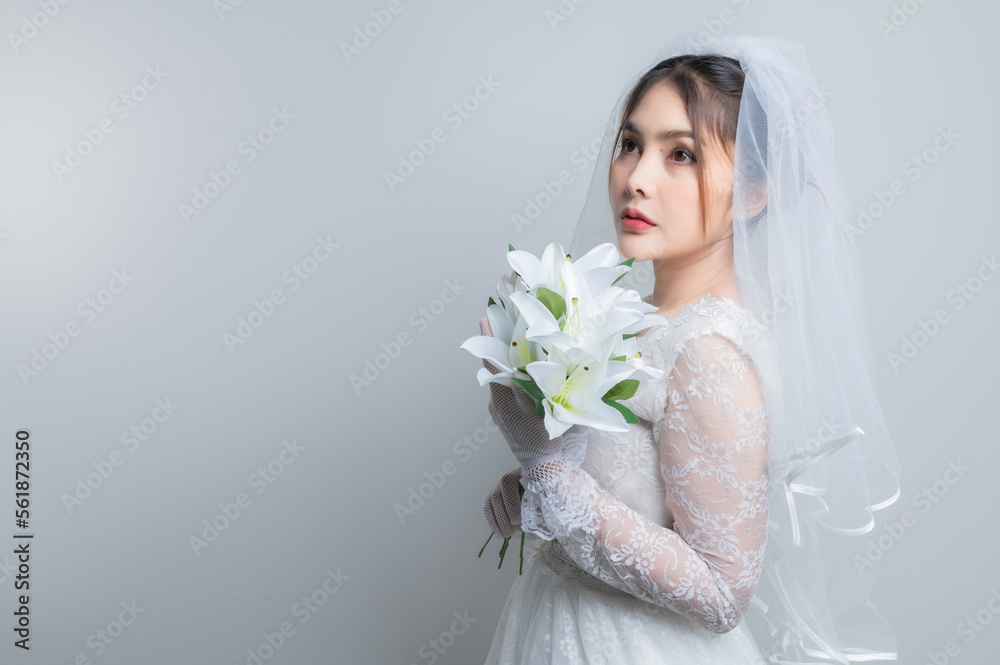 Portrait of asian woman wear bride with flower on white background,Wedding concept Portrait of asian woman wear bride with flower on white background,Wedding concept