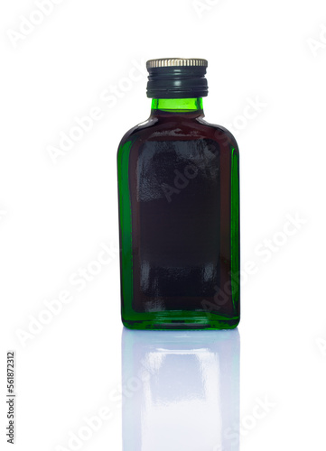 Fotografia small green glass bottle isolated on white background