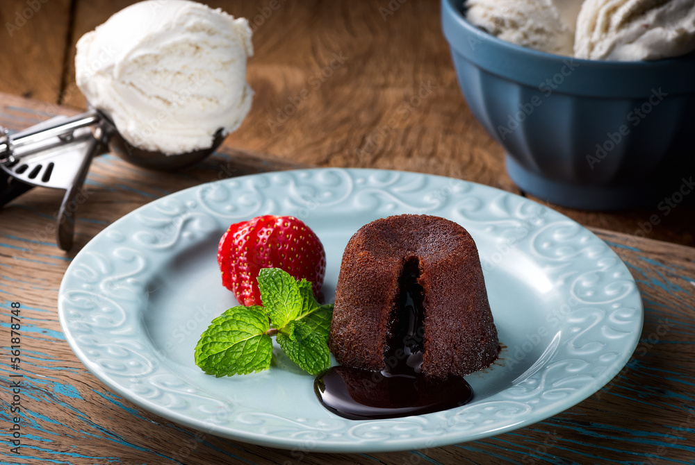 Ταπετσαρία Delicious fresh fondant with hot chocolate and ice cream served on plate