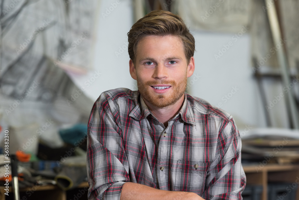 Obraz premium portrait of young man in workshop