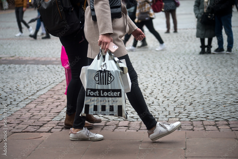 Strasbourg France 16 January 2023 Closeup of woman with a foot locker paper bag in the street Stock Foto Adobe Stock