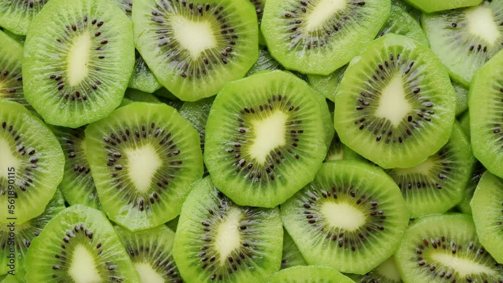 Heap of Sliced kiwi fruits top view, rotation. Fresh and healthy food concept Heap of Sliced kiwi fruits top view, rotation. Fresh and healthy food concept