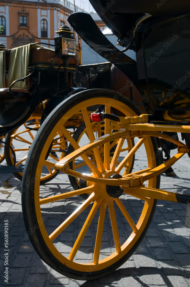 Detail of the yellow wheels on the horse drawn carts used for carrying tourists in Seville, Spain