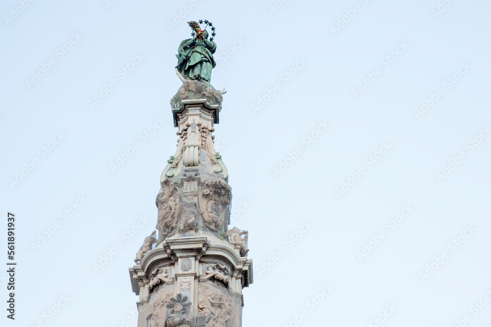 Closeup of obelisk Guglia of the Immaculate Virgin in the center of Piazza Gesù Nuovo located in Naples, Italy Closeup of obelisk Guglia of the Immaculate Virgin in the center of Piazza Gesù Nuovo located in Naples, Italy