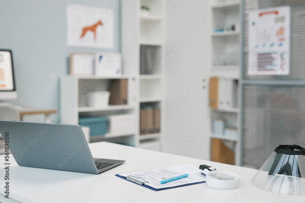 Laptop, medical document and other supplies on veterinarian workplace Laptop, medical document and other supplies on veterinarian workplace