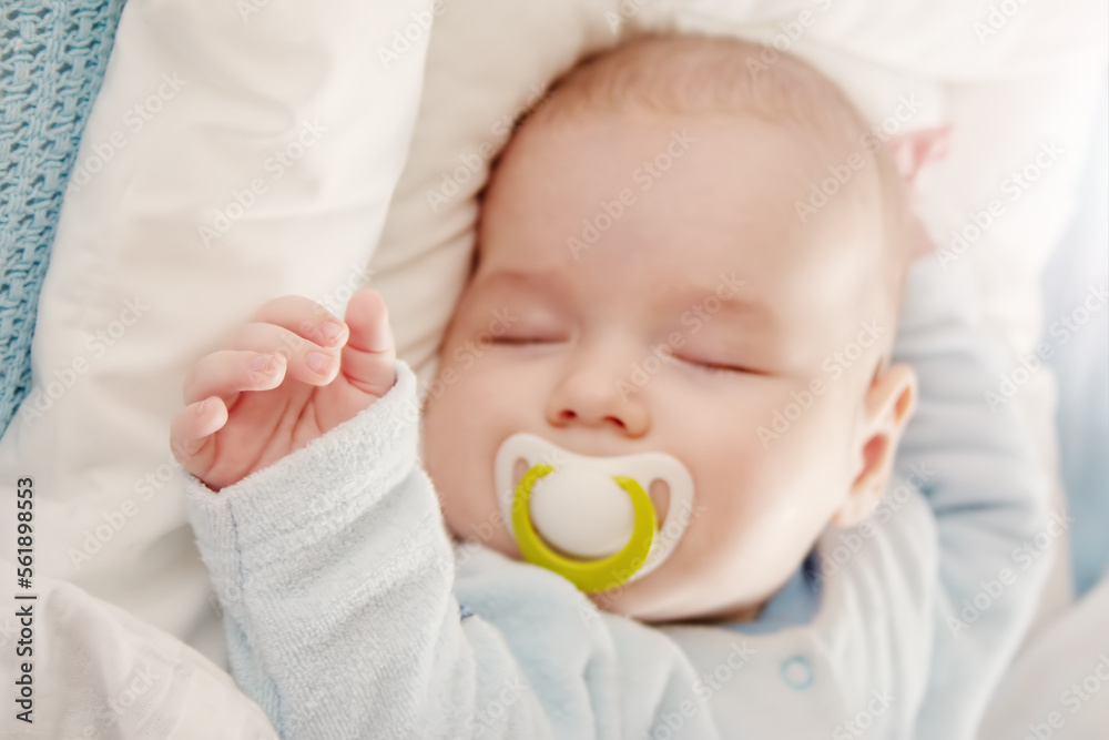 Cute three month old baby sleeping in comfortable bed. Cute three month old baby sleeping in comfortable bed.