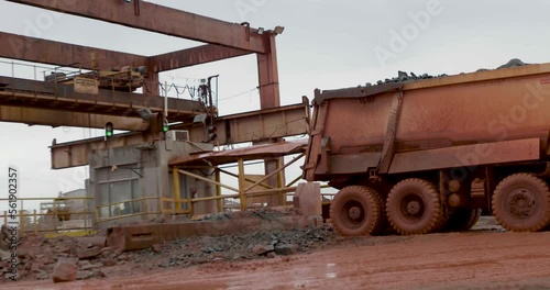Truck dumping mining stones for production process
Mining is the process of extracting useful material from the earth by way of cutting, crushing, burning, or melting.