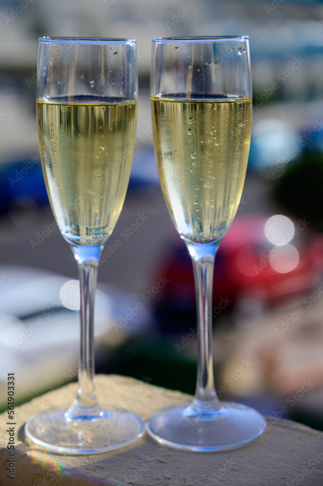 Dinner party, drinking of cava or champagne sparkling wine in vacation resort Caleta Fuste, Fuerteventura, Canary islands vacation, Spain Dinner party, drinking of cava or champagne sparkling wine in vacation resort Caleta Fuste, Fuerteventura, Canary islands vacation, Spain