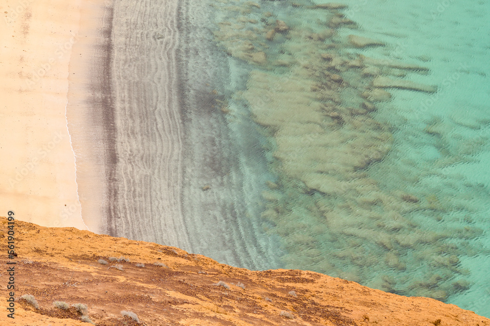 Turquoise waters of La Cocina beach from Montaña Amarilla