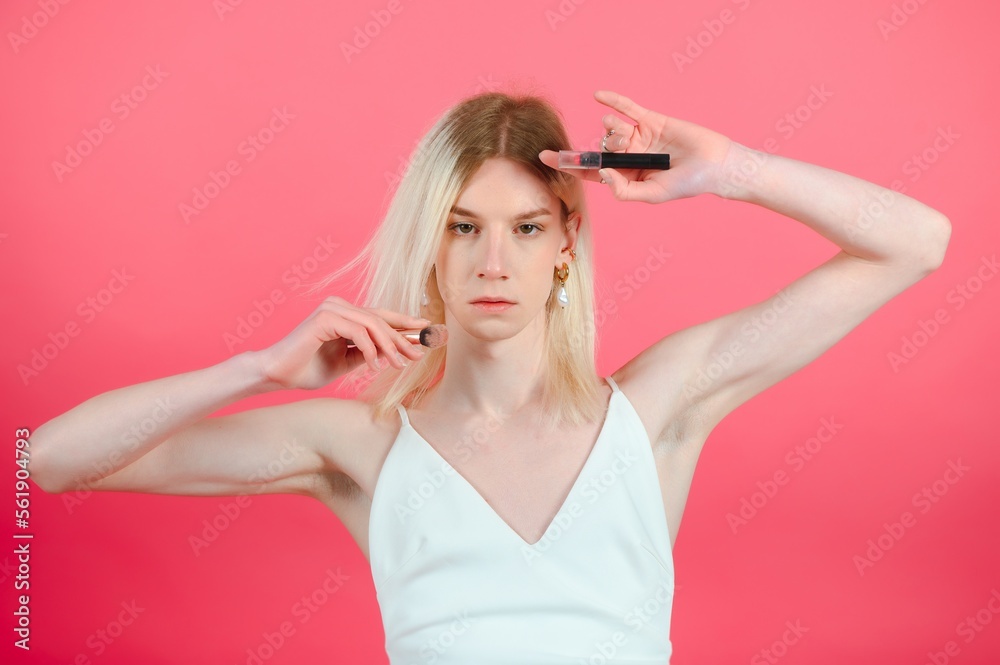 transgender posing isolated in studio. portrait of male model wearing make-up. transgender posing isolated in studio. portrait of male model wearing make-up.