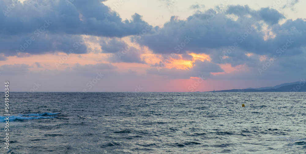 Mediterranean Sea is under cloudy sky on a sunset. Propriano, Corsica Mediterranean Sea is under cloudy sky on a sunset. Propriano, Corsica