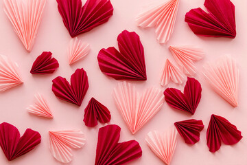 Happy Valentine's day ! Stylish pink and red hearts flat lay on pink paper background. Creative modern valentines hearts cutouts composition. Love background
