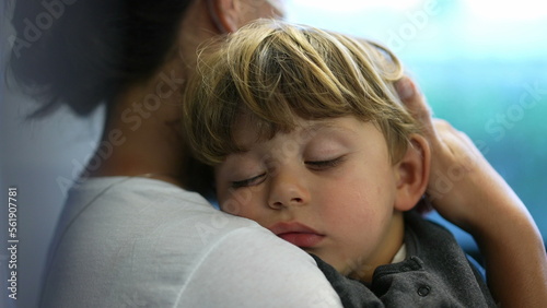 Child sleeping on mother lap travels by train transportation