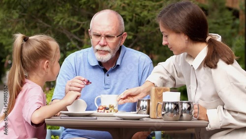 Family breakfast in a street cafe