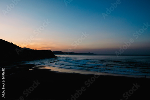 Panoramic view of a Cantabrian beach at sunset.