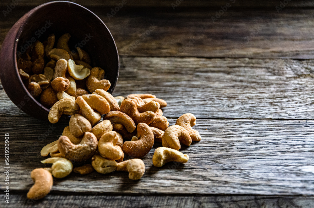 Fototapeta premium Cashew nuts roasted in a ceramic bowl.