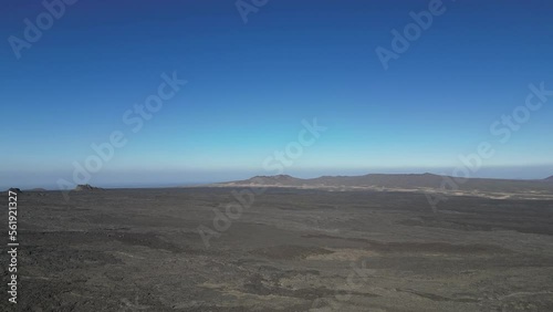 Aerial views over the black volcano (Jabal Qidr) in Harrat Khaybar, north west Saudi Arabia photo