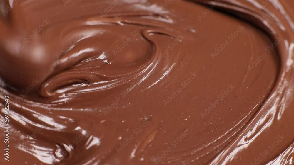 Knife stirs chocolate hazelnut butter slow motion Knife stirs chocolate hazelnut butter slow motion