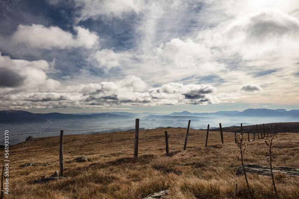 fence in the carinthian mountains , made for cows, looking southeast towards Slovenia.