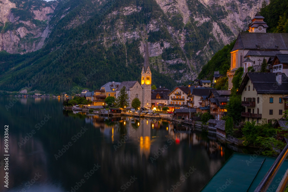 Fototapeta premium Austria, Hallstatt historical village. UNESCO world heritage site, old European architecture in sunlight. Hallstatter see in background. Hallstatt is iconic world landmark.