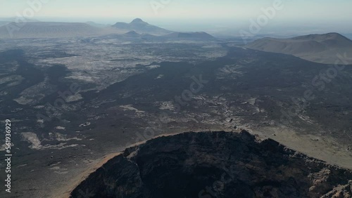 Aerial views over the black volcano (Jabal Qidr) in Harrat Khaybar, north west Saudi Arabia photo