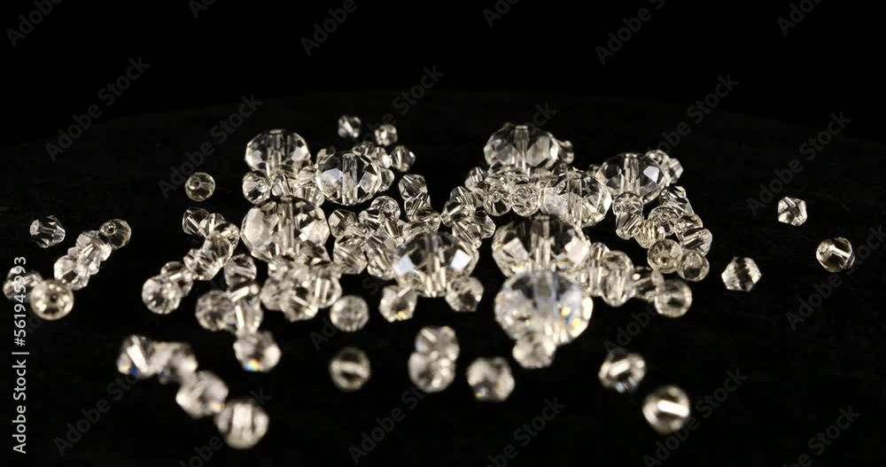 Clear white jewelry crystals and rhinestones on black velvet.