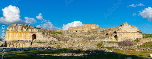 Panoramic view of ruins of antique Greek theatre in Miletus on western coast of Anatolia in ancient Caria, modern Turkey photo