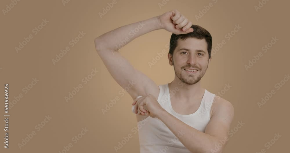 Man with a big smile who looks after himself in the bathroom. Young man