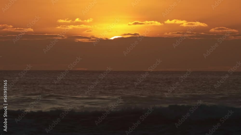 The sea is agitated at the orange bright sunset The sea is agitated at the orange bright sunset