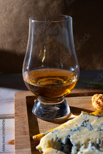 Tasting of Scottish single malt or blended whisky with English cheeses blue stilton and shropshire