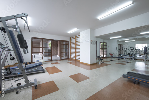 A community gym located in a room on the ground floor of a building