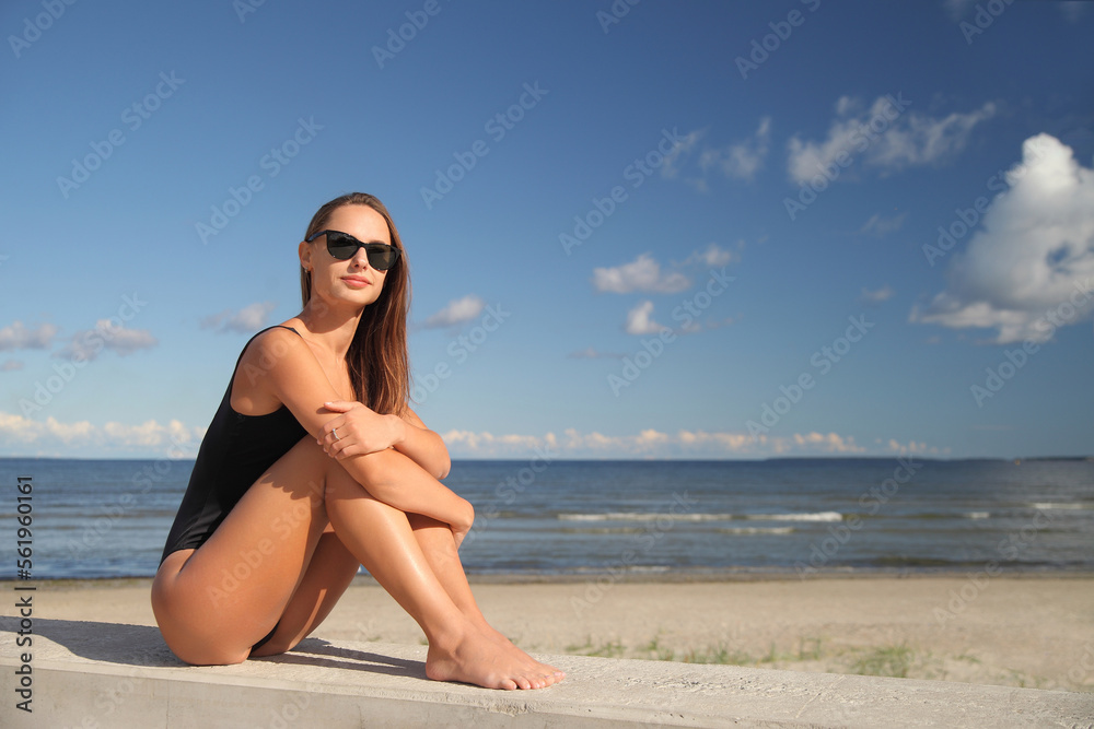 beauty athletic woman in a swimsuit on the beach beauty athletic woman in a swimsuit on the beach
