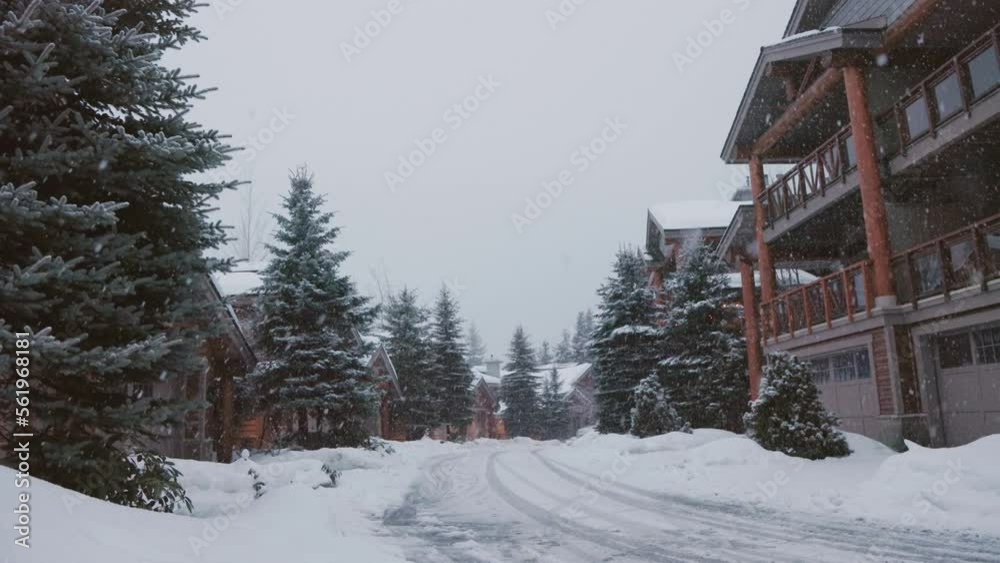 Alpine homes at the foot of Whistler Mountain, snow falling trees, winter scene, log cabin, luxury vacation home. 4K 24FPS Alpine homes at the foot of Whistler Mountain, snow falling trees, winter scene, log cabin, luxury vacation home. 4K 24FPS