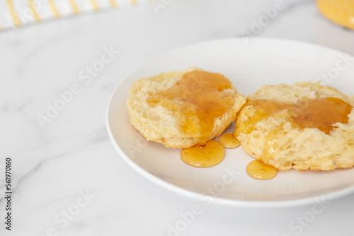 Close-up of Freshly Baked Homemade Buttermilk Biscuits with Honey