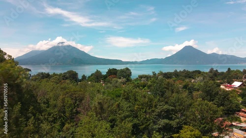Aerial Fly Away from Lake and Volcanoes - Summer - Lake Atitlan, Panajachel, Guatemala photo