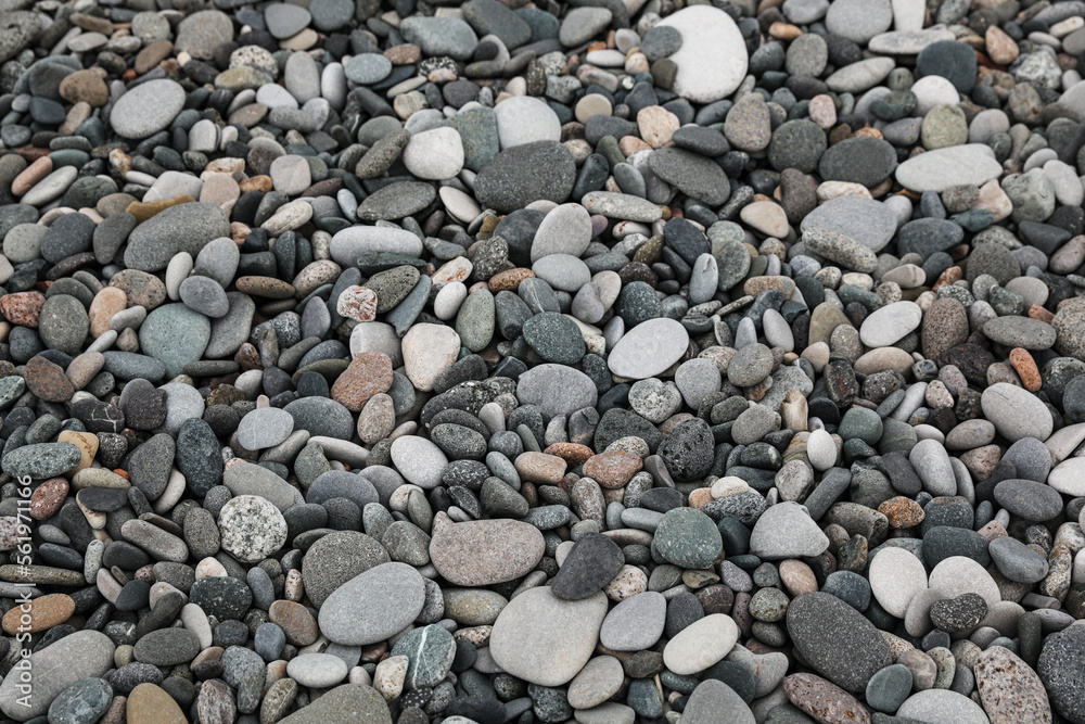 Surface covered with many different pebbles as background Surface covered with many different pebbles as background