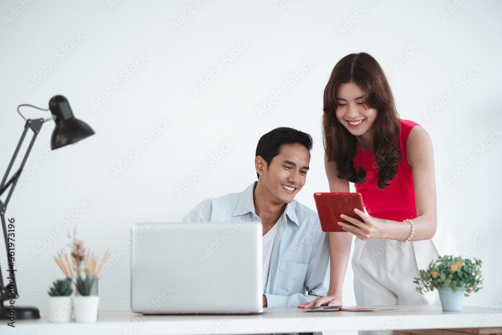 Travel concept, Happy Asian young couple using a laptop and booking hotel online with a credit card, woman holding passports with tickets, prepare to travel Travel concept, Happy Asian young couple using a laptop and booking hotel online with a credit card, woman holding passports with tickets, prepare to travel