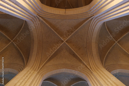 Detail of cream brick vault  arch  rib wall  column and clerestory element on the ceiling of expressionist protestant church in Copenhagen  Denmark. 