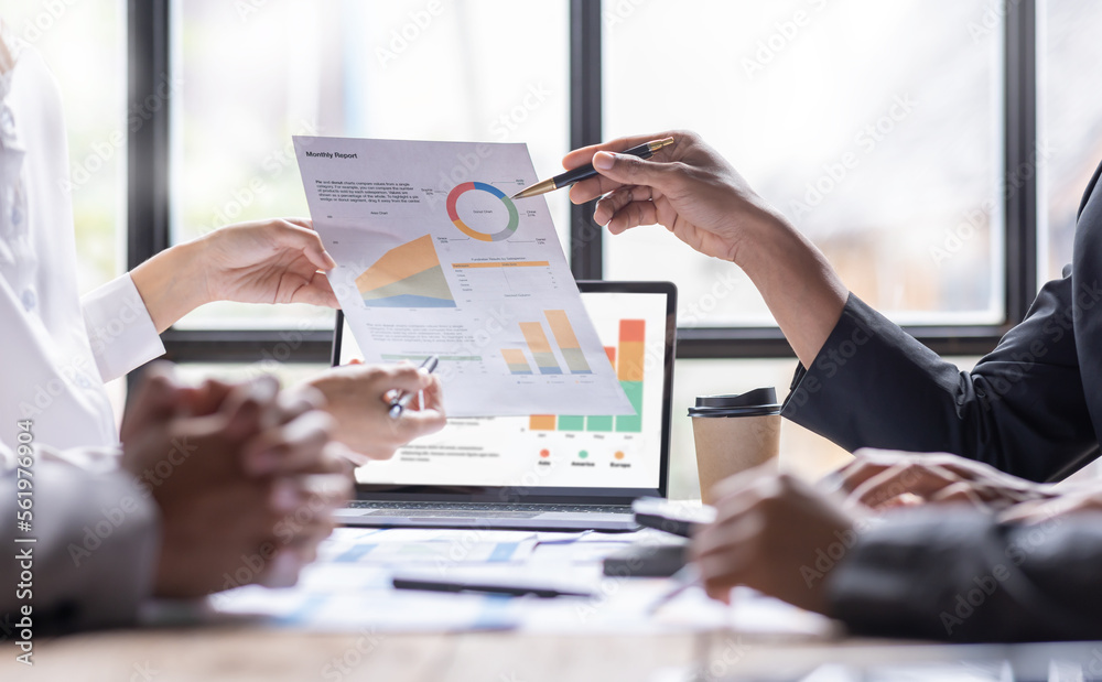 Group of confident business people point to graphs and charts to analyze market data, balance sheet, account, net profit to plan new sales strategies to increase production capacity.
Group of confident business people point to graphs and charts to analyze market data, balance sheet, account, net profit to plan new sales strategies to increase production capacity.