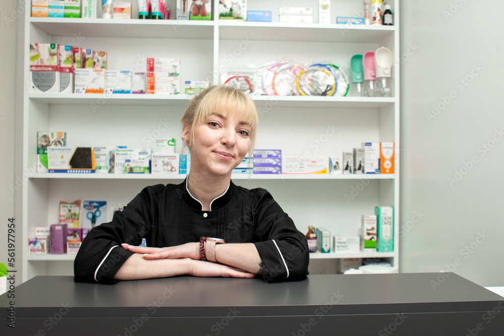 portrait of female administrator of a medical clinic in a black uniform against the background of the reception portrait of female administrator of a medical clinic in a black uniform against the background of the reception