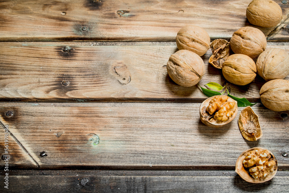 Shelled walnut with green leaves. Shelled walnut with green leaves.