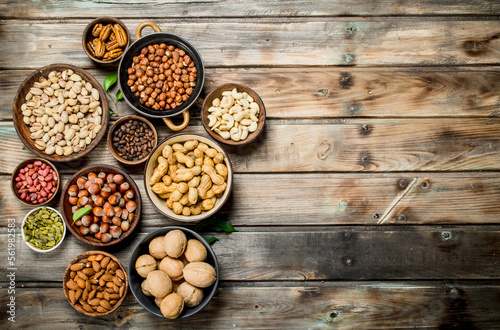 Assortment of different nuts in bowls.