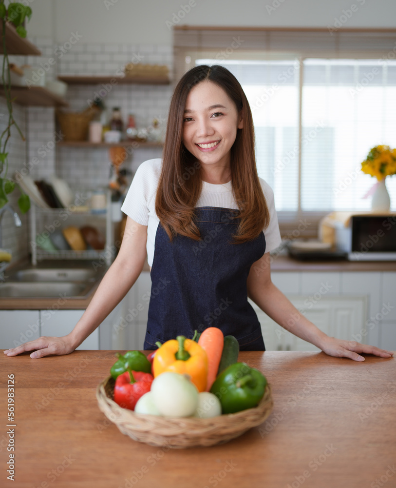 Portrait of beautiful young asian woman making salad at home. cooking food and Lifestyle moment Portrait of beautiful young asian woman making salad at home. cooking food and Lifestyle moment