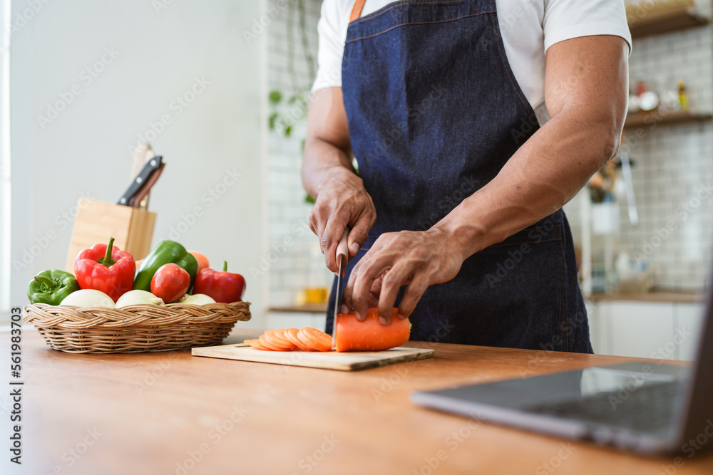 Portrait of asian man making salad at home. cooking food and Lifestyle moment Portrait of asian man making salad at home. cooking food and Lifestyle moment