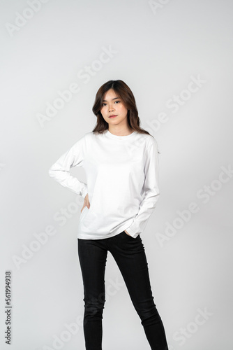 An asian woman wearing a white blank long sleeve shirt doing a pose