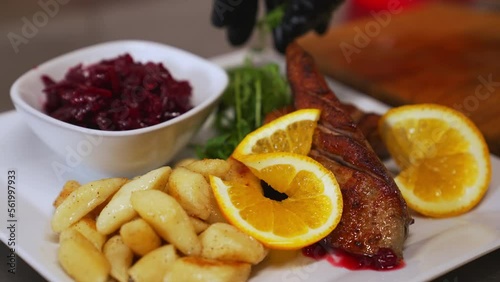 Wallpaper Mural Duck dish. Closeup shot of duck fillet served with potato dumplings and slices of oranges. Combination of modern and traditional cuisine. High quality 4k footage Torontodigital.ca