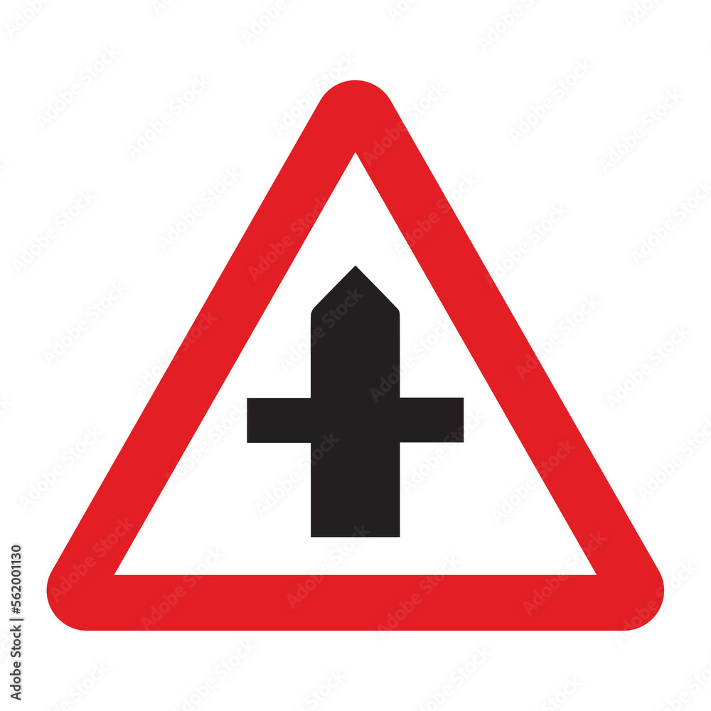 Cross road sign in a red triangle with black sign and traffic sign. UK