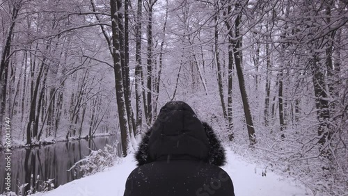 Person in Black Boat in Beautiful Snowy Nature Scenery in Poland Forest photo