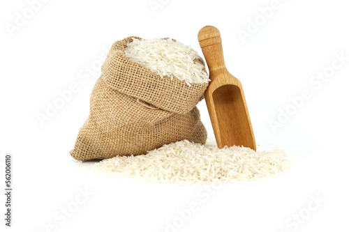 Long-grain rice in burlap sack and wooden scoop